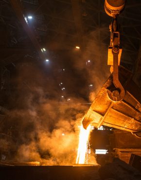 Tank pours liquid metal in the molds at the steel mill